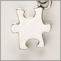 Sterling silver puzzle piece charm
